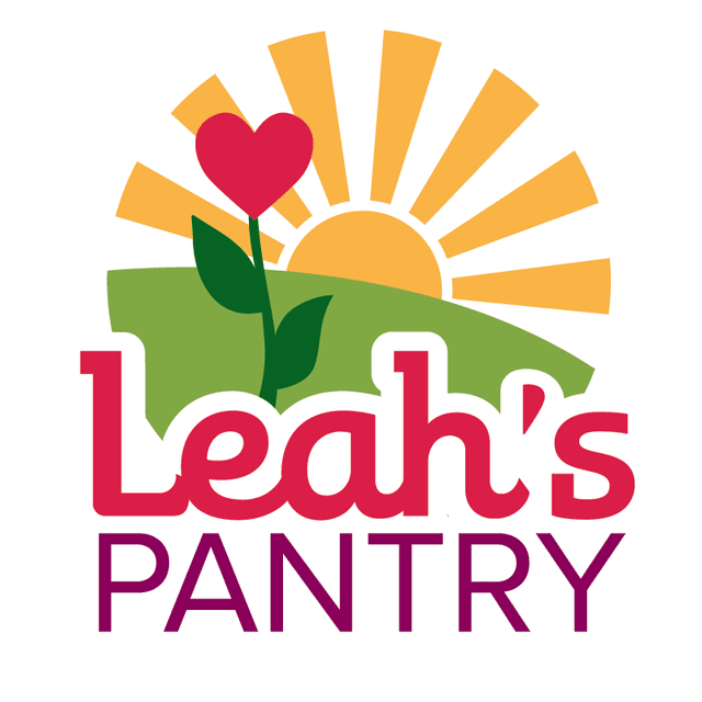 A rising sun over a green hill behind a blooming flower in the shape of a heart. Below the hill and flower it says Leah's Pantry